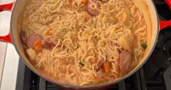 Creamy Alfredo Tomato Pasta with Chicken, Shrimp and Sausage