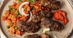 Balkan-Style Cevapcici with Savory Red Pepper Rice